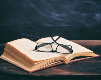 Reading classes on top of a book.